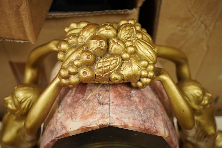 A French Art Deco figural and rouge marble clock garniture, 56cm wide. Condition - poor
